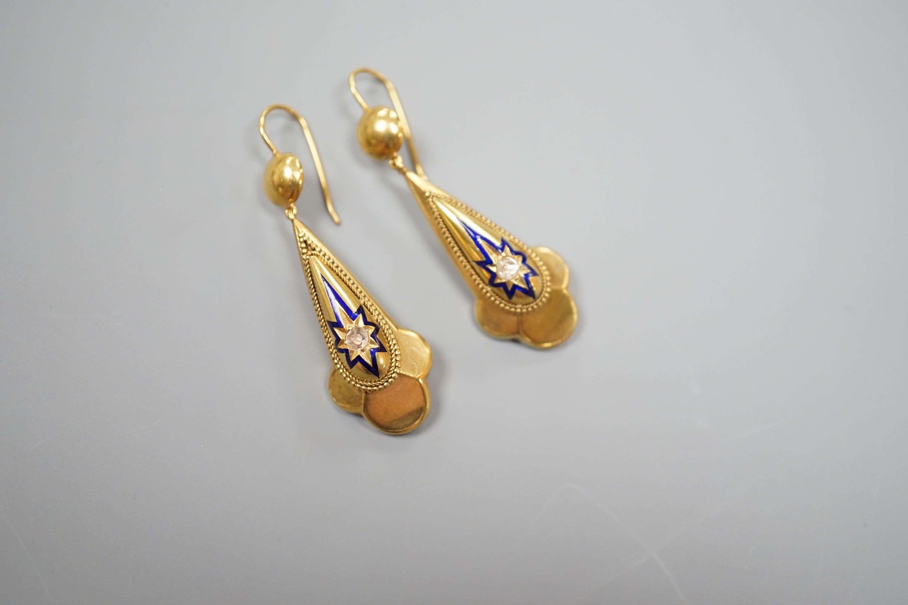A pair of antique yellow metal, blue enamel and single stone rose cut diamond set drop earrings, overall 46mm, gross weight 7.1 grams.